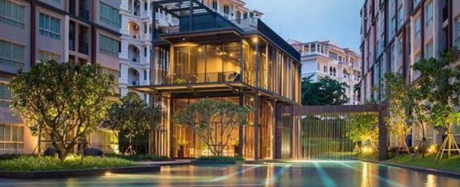 Condominium building in Phuket with shared facilities and pool, representing management by the condominium juristic person.