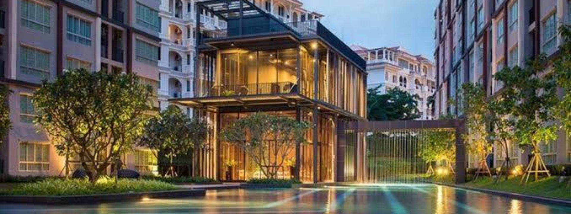 Condominium building in Phuket with shared facilities and pool, representing management by the condominium juristic person.