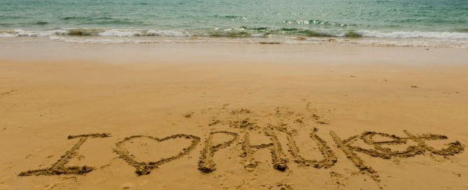 “I love Phuket” written in the sand on a beach in Phuket.