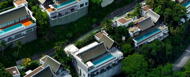 Hillside luxury villas with private pools surrounded by greenery in Phuket