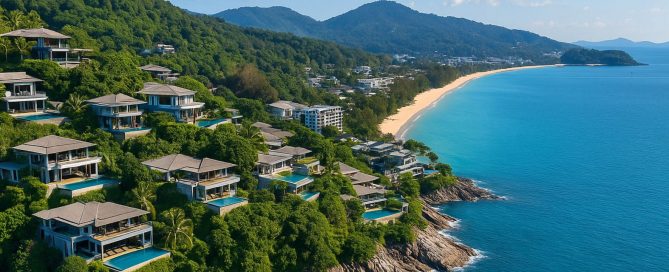 Aerial view of luxury cliffside villas overlooking Kamala Beach in Phuket, showcasing high-end branded residences attracting overseas buyers.