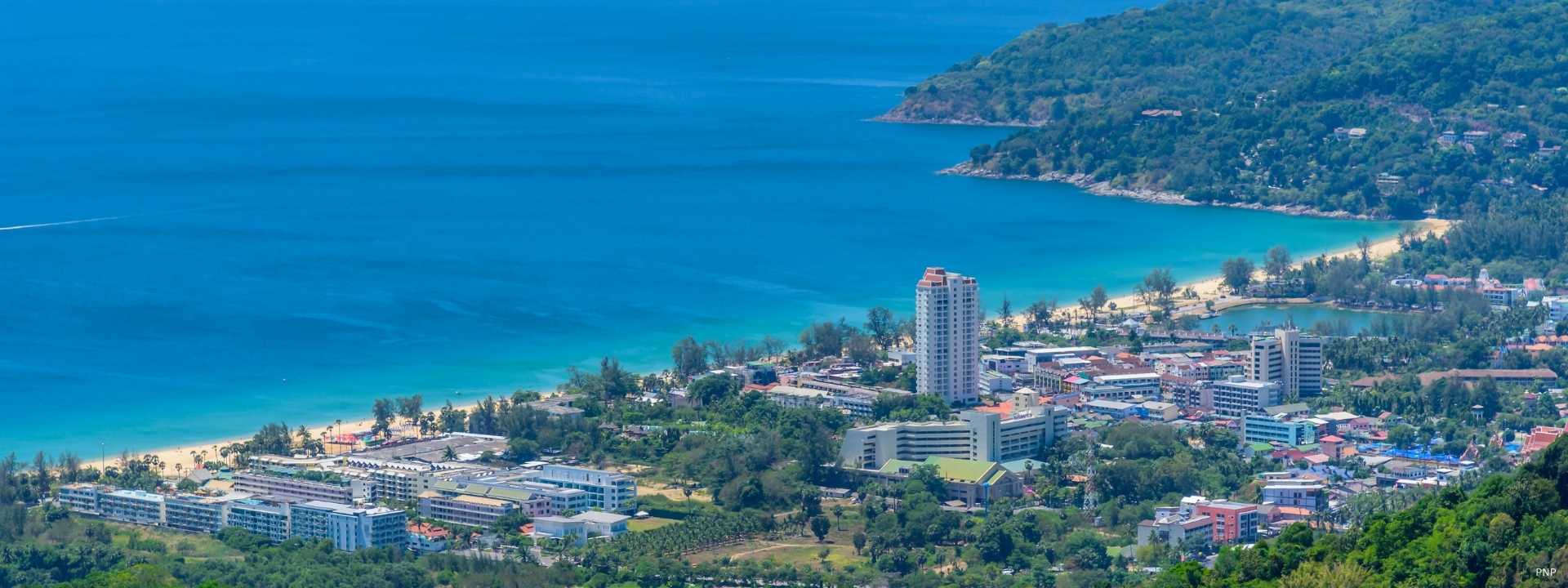 Aerial view of Kata Beach and surrounding residential and resort area in western Phuket