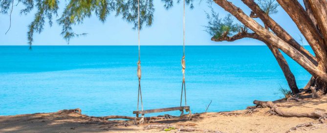 Tree swing on the beach at Mai Khao in Phuket, highlighting the area’s undeveloped and protected coastline.