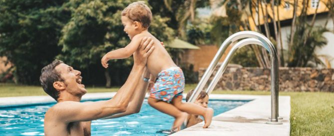 Family enjoying private swimming pool at a residential villa in Phuket