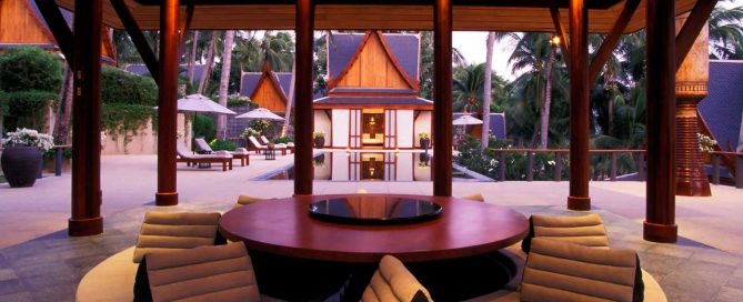Luxury Thai-style villa courtyard in Phuket with pavilion seating and private pool