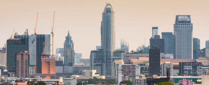 Bangkok skyline with condo developments and construction cranes representing Thailand’s property market